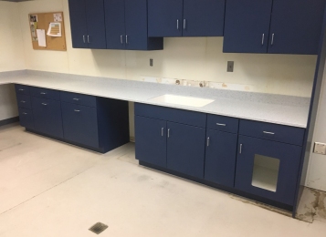 New cabinetry, Corian countertops and an integrated Corian bowl were fabricated in-house and installed for Canine Partners For Life in Cochranville, PA. We also replaced damaged cabinet doors and drawer heads in the grooming room. The kitchen received a full renovation.