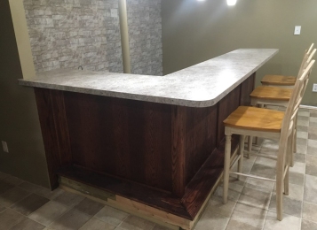 Upper and lower custom-made countertops for a resident and Oxford remodeled their basement. This was her final touch!