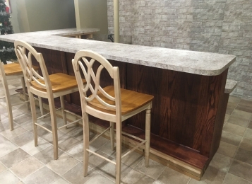Upper and lower custom-made countertops for a resident and Oxford remodeled their basement. This was her final touch!
