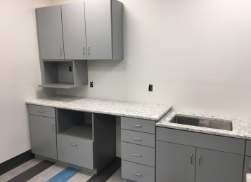 Commercial kitchen at Cambria quartz tops of plywood construction three mill edge on all doors in your head. Undermount stainless steel sink. Industrial facility in Delaware! Kitchenette for employees!