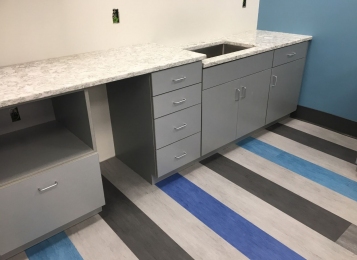 Commercial kitchen at Cambria quartz tops of plywood construction three mill edge on all doors in your head. Undermount stainless steel sink. Industrial facility in Delaware! Kitchenette for employees!