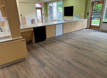 Commercial project a daycare center down in Delaware all custom cabinets, Corian tops, and three mill edging on all doors which adds extra durability. All drawers, full extension drawer slides. Custom cabinetry directly into exterior wall, countertop and cabinets built around notched window area.