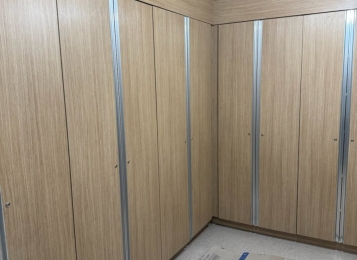 Custom made tall storage cabinets with six hinges per door. Custom applied continuous aluminum pool with laminate, soffit above cab cabinetry built around column that you cannot see.