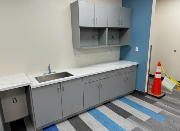 Custom made plywood construction cabinets with stainless steel Undermount sink under Corian tops all cabinetry plywood with applied three mill edge on cabinet doors for extra door ability.