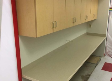 Custom made wall cabinets Formica  top with three MiL edging for durability.