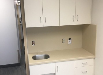 Doctor’s office in Flemington, New Jersey and exam room Corian tops, Corian backsplash, brand new cabinetry.