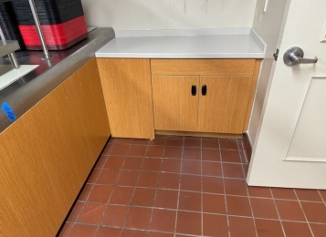 Before and after pictures of a cafeteria job! New cabinet and Corian top at the end of the serving line and a new façade laminated front