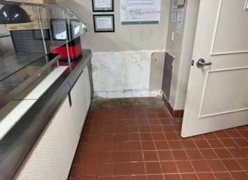 Before and after pictures of a cafeteria job! New cabinet and Corian top at the end of the serving line and a new façade laminated front