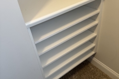 Custom closet art station with shelving – wooden tops with conversion varnish applied.