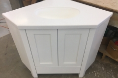 Custom made corner cabinet for residential doors, custom-made in our shop as well. Sprayed white with conversion varnish 